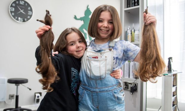 Zoe and Alix Stewart after their haircuts at Paul's Hair Studio in Kirriemuir. Image: Kim Cessford/DC Thomson
