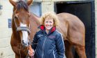 Trainer Lucinda Russell with 2024 Grand National favourite Corach Rambler at her yard in Milnathort.