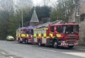 Fire crews and an ambulance at the scene in Leslie.