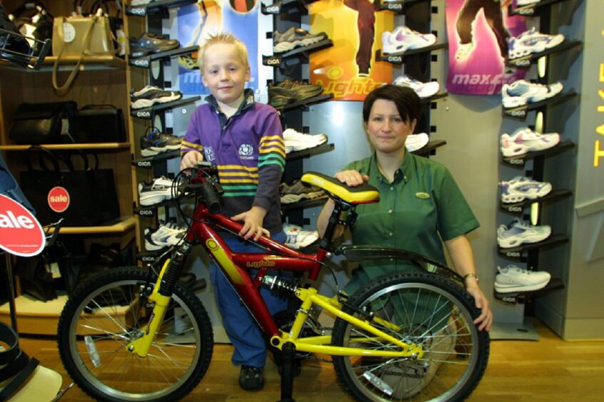 James Walton with Diana Smith after winning a bike in a Clarks competition in 2001.