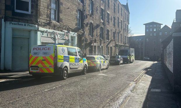 Police and paramedics at Milnbank Road, Dundee. Image: Poppy Watson/DC Thomson