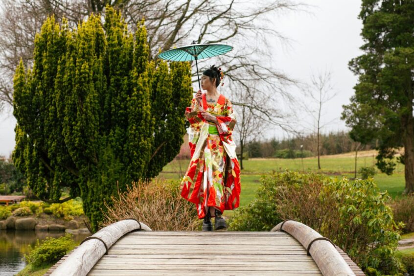 Model Sally Pritchett at The Japanese Garden in Cowden, Scotland, wearing an antique kimono ahead of the opening of the exhibition in Dundee. 