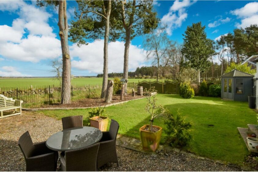 Patio area and surrounding gardens.