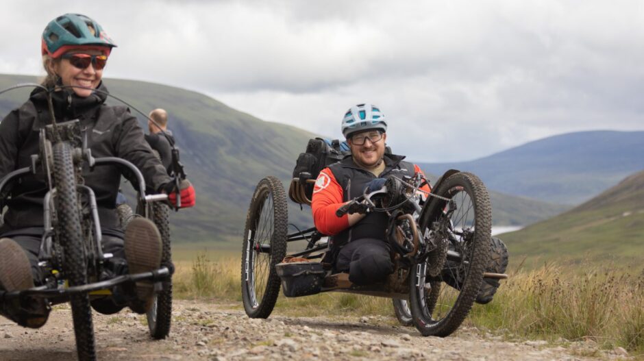 A grin from Neil as he cycles past on the way to the 'secret' bothy. Image: Stefan Morrocco.