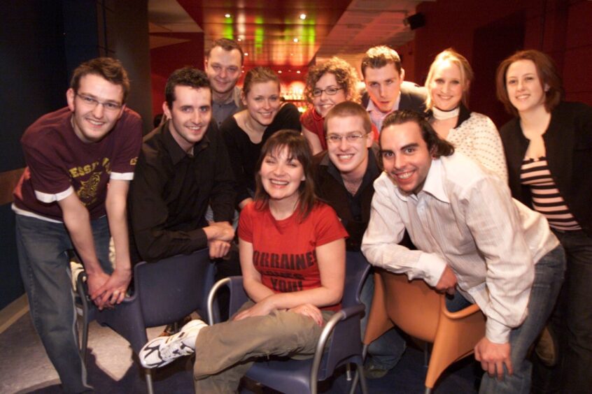 Lorraine Kelly, seated, celebrates with Dundee University students after winning the ballot in February 2004.