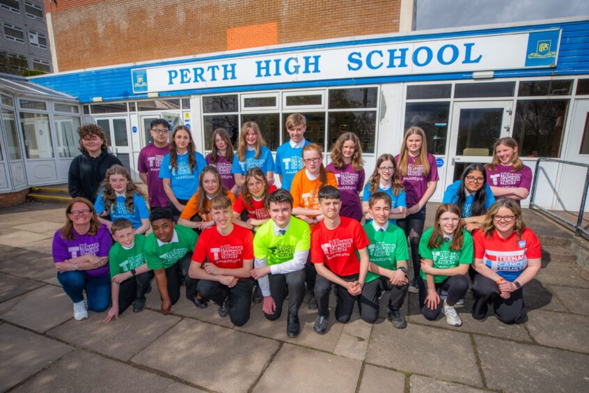 Pupils lined up in colourful running gear at entrance to Perth High School
