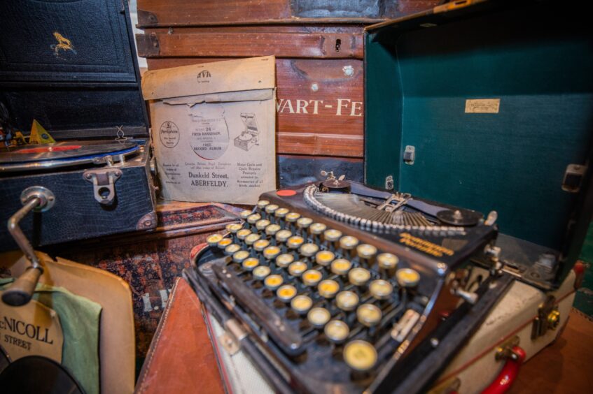 Close up of old typewriter, gramophone and records