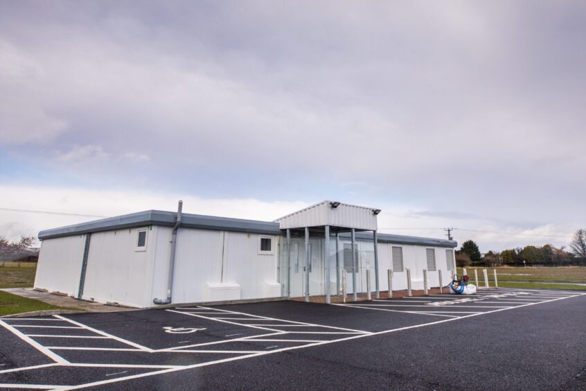 Carse Medical Practice exterior - white, temporary buildings in a field near Errol