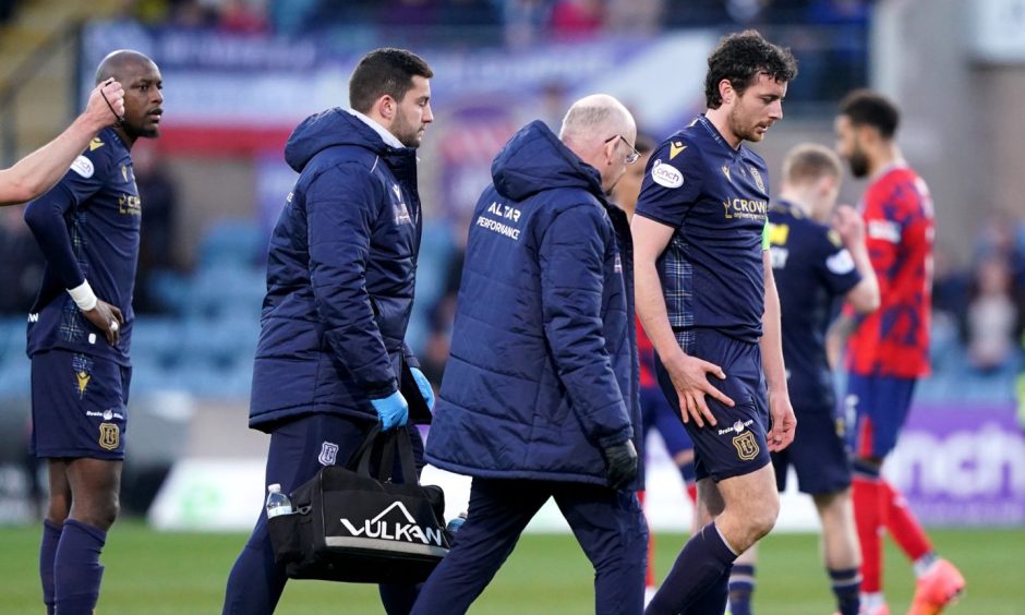Joe Shaughnessy limps off after injuring his knee against Rangers.