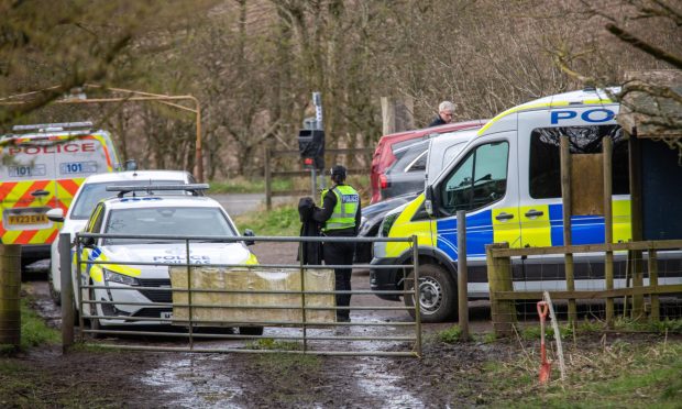 Police and forensics officers at Auchtermuchty Common.