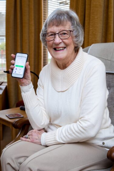 Elspeth, who has the condition essential tremor, with the device she uses to control her tremors. 