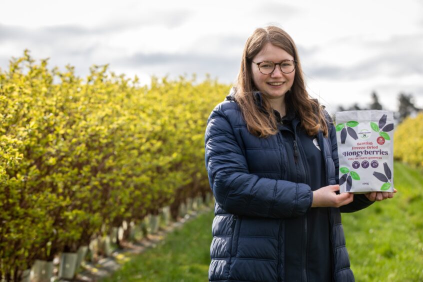Catherine Sim and one of their products, the freeze-dried honeyberries, at West Hall Farm, near Cupar.