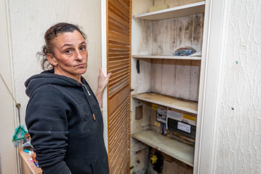 Izzy Bruce shows some of the mould and damp at her Methil flat.