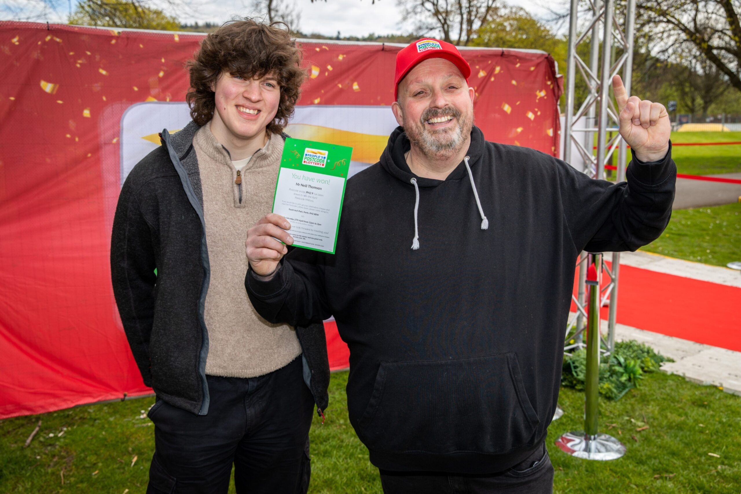 People's Postcode Lottery winner Neil Thomson, right, with Matthew Thomson (18). 