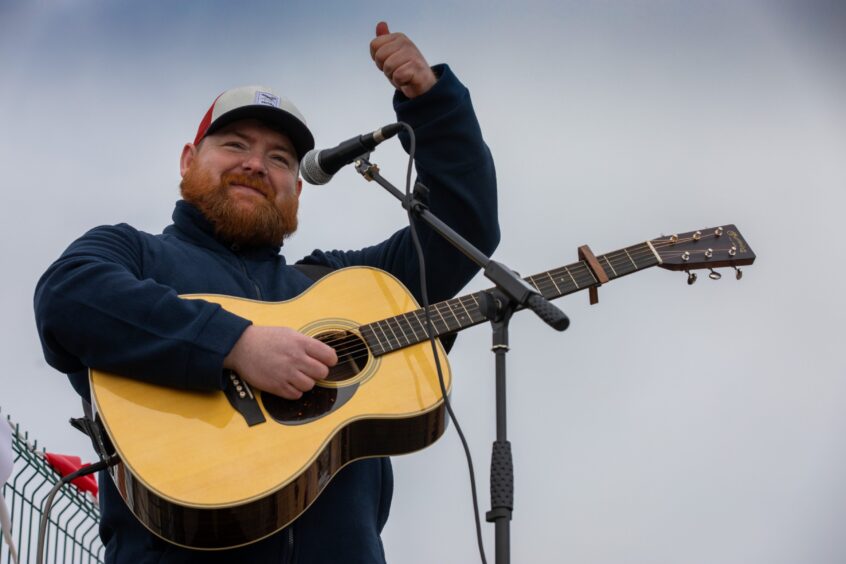 Cammy Barnhes sings at arrival of new Anstruther lifeboat.