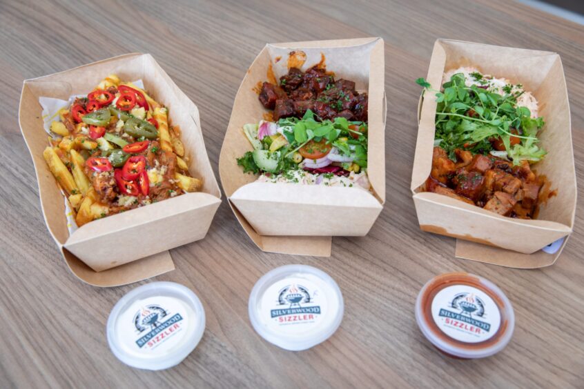 Three paper boxes of food from the new Perthshire food truck, Silverwood Sizzler.