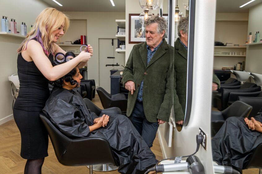 Thomas McKiver, chats with colourist Reanne McKeown, who is styling Sheila McKiver, wife of Tom, at new salon tom on Union Street in Dundee. 