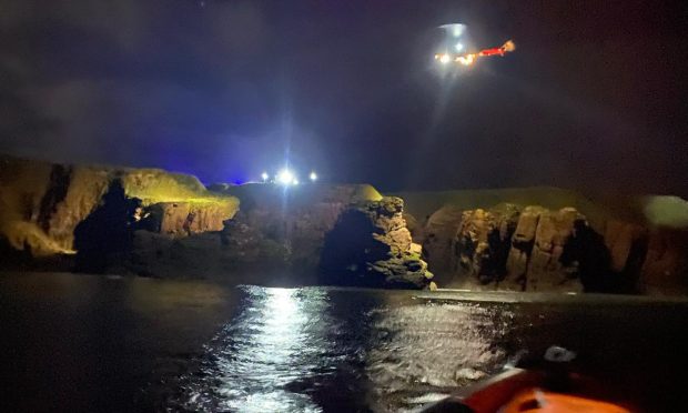 Lifeboat at Coastguard helicopter in Arbroath during late-night rescue incident