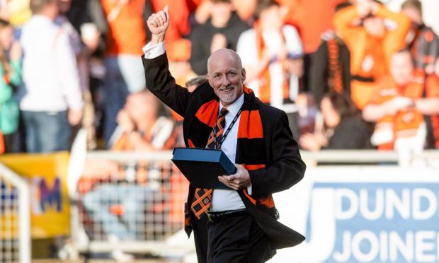 Dundee United owner Mark Ogren on the pitch at Tannadice