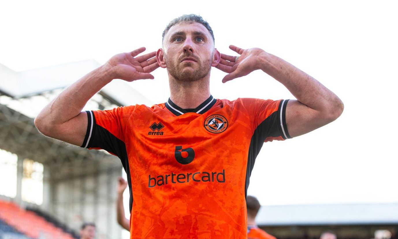 Louis Moult celebrates a goal for Dundee United at Tannadice
