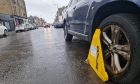 A car with its wheel clamped on King Street, Broughty Ferry. Image: Andrew Robson/DC Thomson