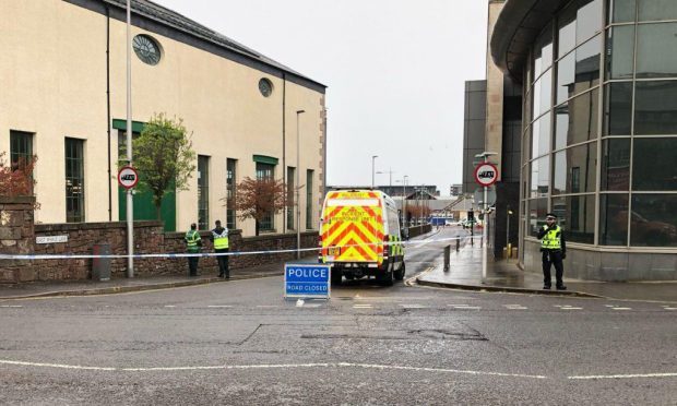 Police have taped off the entrance to East Whale Lane, next to the Olympia. Image: James Simpson/DC Thomson