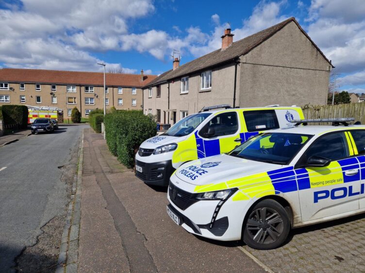 Police car and van at Craigmount Place in Dundee.