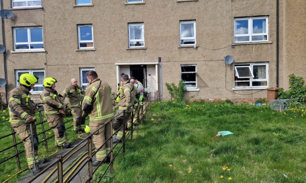 Firefighters outside the flats on Craigmount Place in Dundee. Image: Andrew Robson/DC Thomson