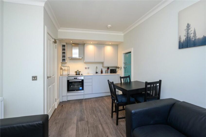 The open-plan living room and kitchen of the flat on South Street in St Andrews. 