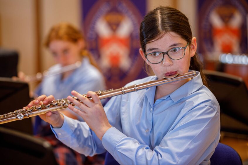 St Leonards school pupil playing the flute