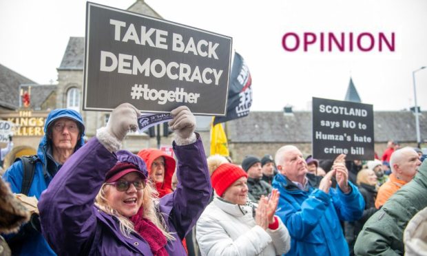 Campaigners outside Holyrood on Monday to protest against hate crime laws. Image: Lesley Martin/PA Wire