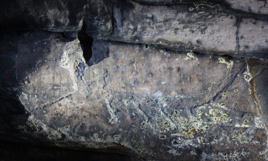 The ancient boat carving at the Wemyss Caves. Image: Supplied by SWACS.