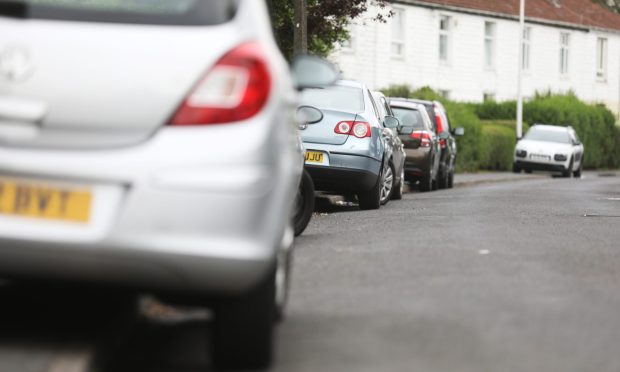 Cars parked along the pavement on Ancrum Drive in 2023