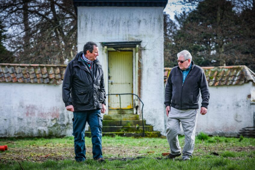Friends of Craigtoun's funding director Henry Paul and chairman Doug Stephen by the deteriorating Dutch Village in Craigtoun Park. 