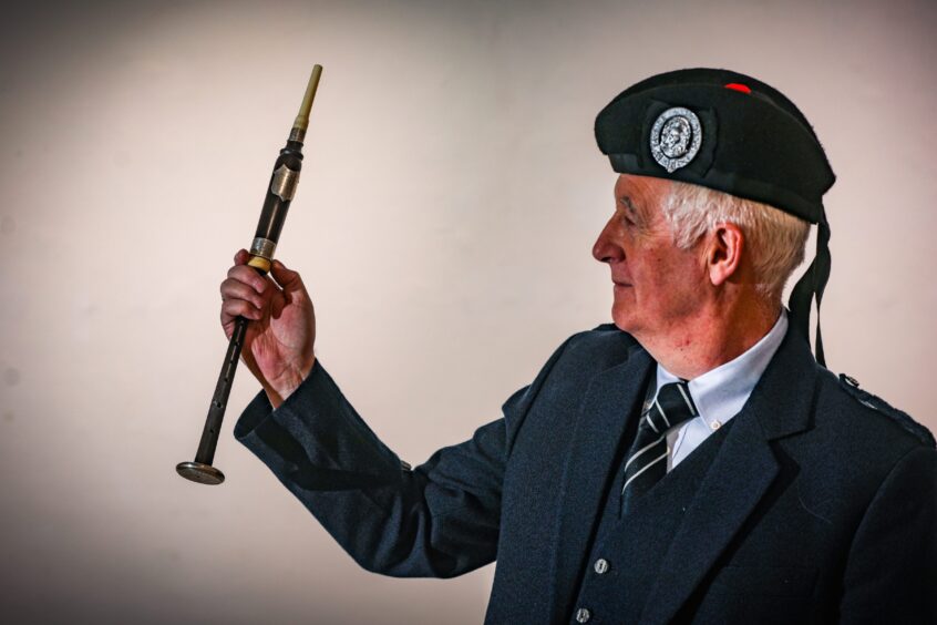 Mike Crofts with an exhibition pipe chanter.