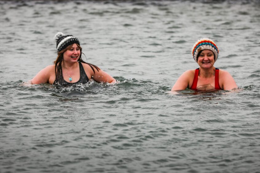 Rebecca Baird joins Lisa Henry in the water at Pittenweem for a 'sober swim'.