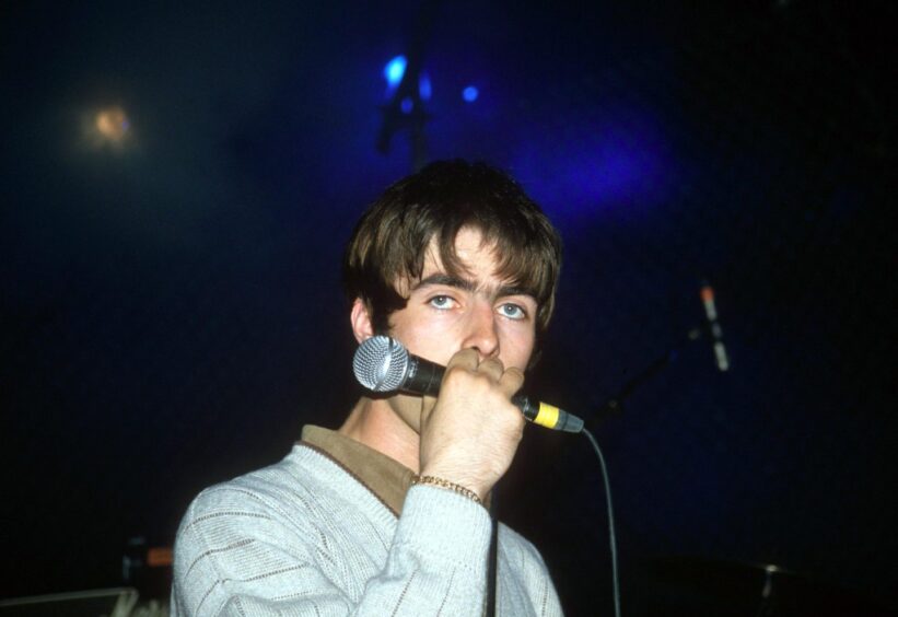 Liam Gallagher on stage in 1994. 