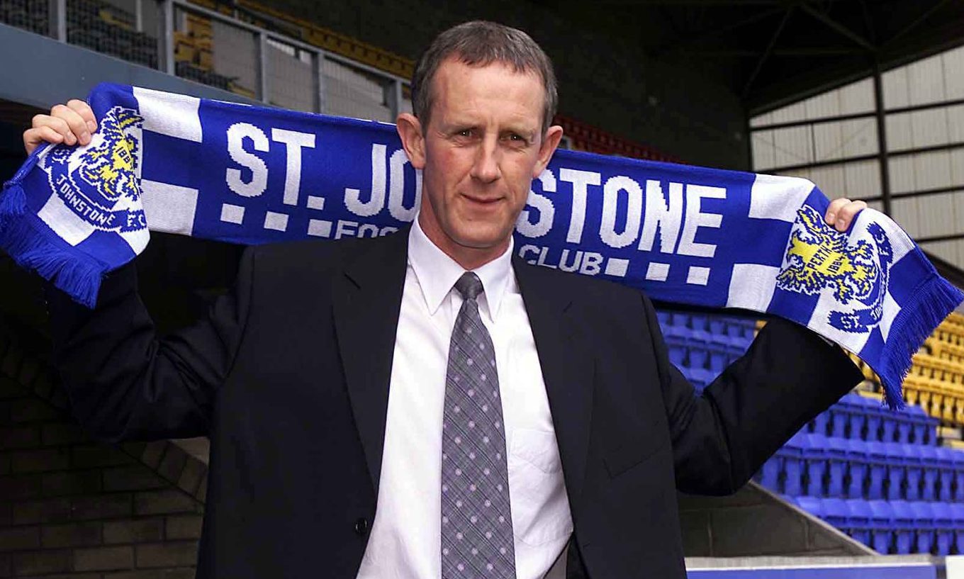 Billy Stark hold aloft a Saints scarf as he is appointed as St Johnstone manager in October, 2001.