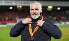Dundee United boss Jim Goodwin sports his medal