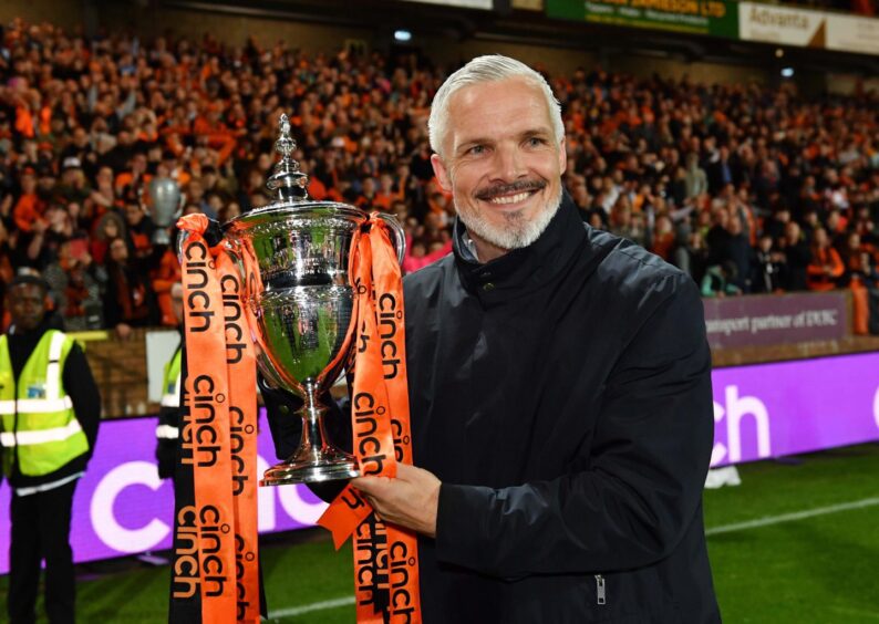 Jim Goodwin poses with the Championship trophy