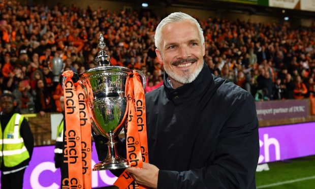 Jim Goodwin poses with the Championship trophy