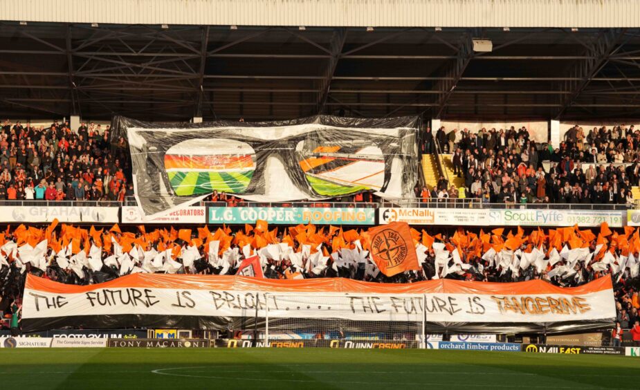 Dundee United fans hold up banners at Tannadice Park 