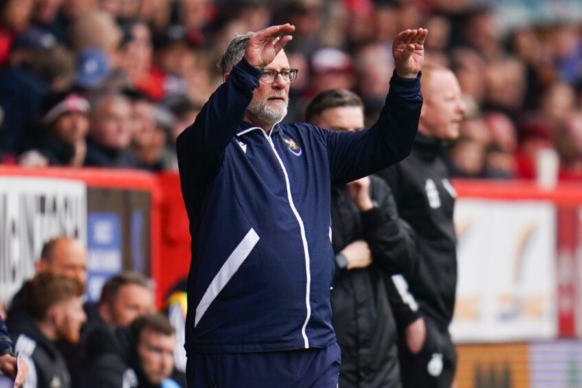 Craig Levein gestures on the sideline at Pittodrie.