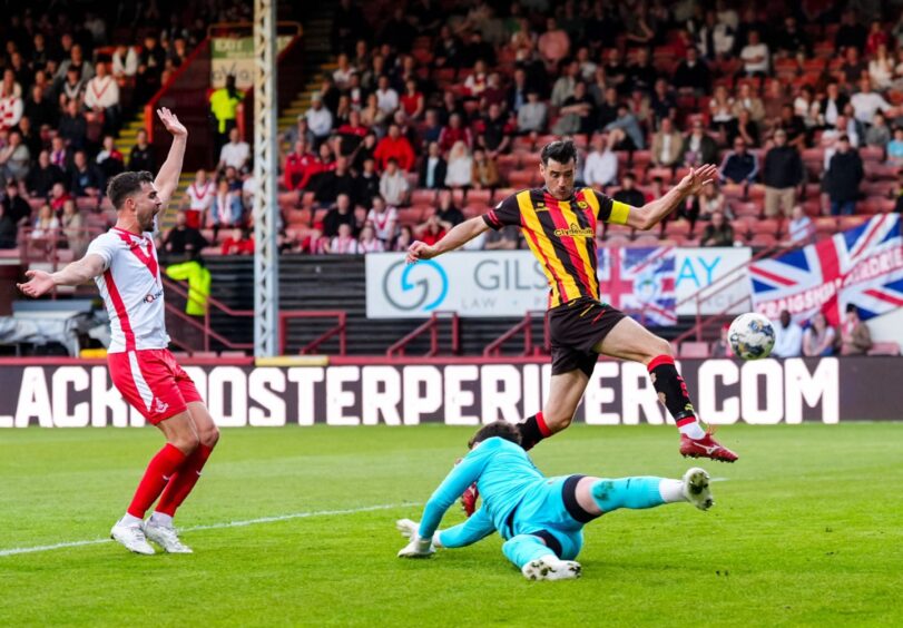 Brian Graham turns in Partick Thistle's opening goal against Airdrie.