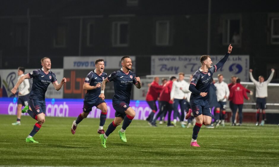 The Raith Rovers players run to celebrate Lewis Vaughan's winning penalty in their play-off semi-final against Partick Thistle.