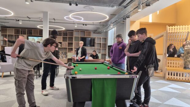 Young people at pool table at Y Centre in Perth