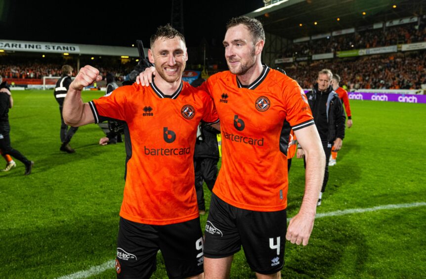 Dundee United's Kevin Holt, right, soaks up the atmosphere with teammate Louis Moult