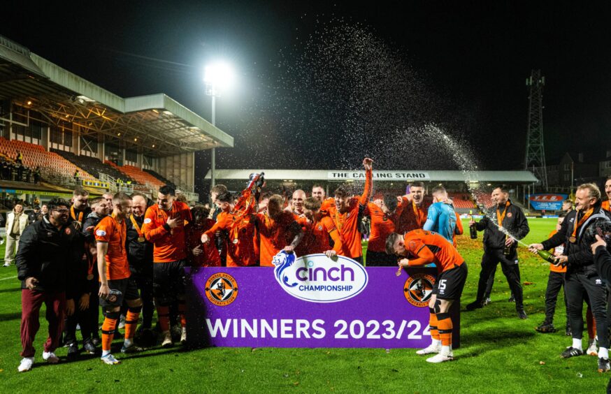 Dundee United players and staff celebrate their title win