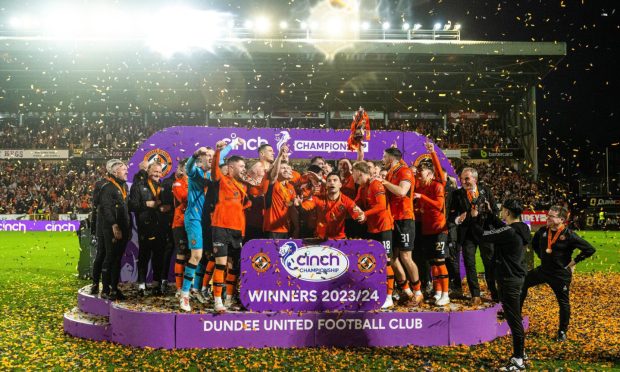 The Dundee Unite4d players celebrate their Scottish Championship title. Image; SNS.
