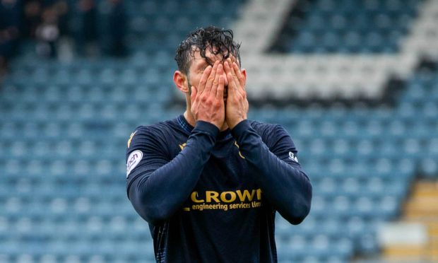 Dundee's Antonio Portales crestfallen at full-time against St Mirren. Image: SNS